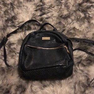 BCBG black snake skin mini back pack